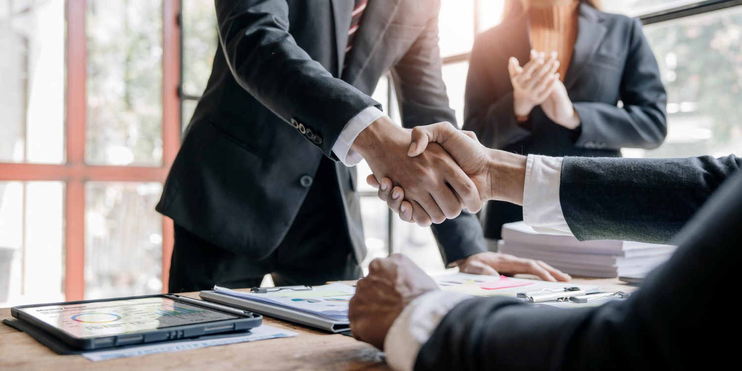 business-people-shaking-hands-finishing-up-meeting-business-etiquette-congratulation-merger-acquisition-concept